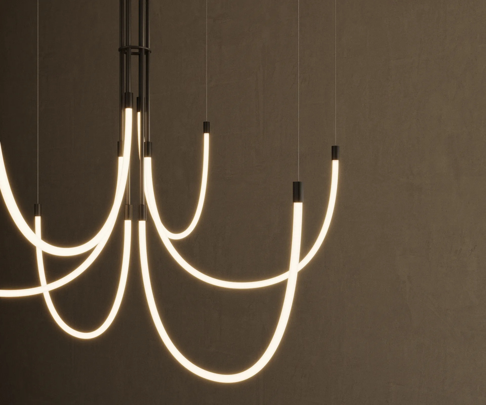 Colgante Cram: lazos luminosos de tubos de silicona sobre una pared oscura enlucida