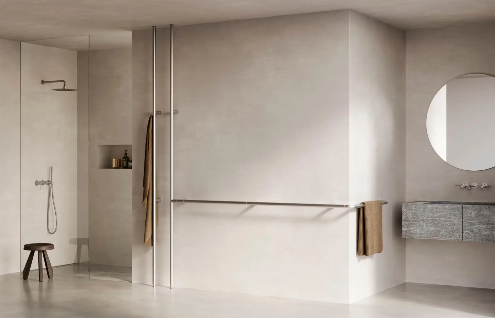 Toallero eléctrico Infinito en un baño con paredes de hormigón